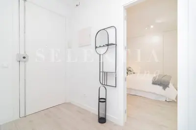 Cama o camas de una habitación en Castellana Suites