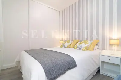 Cama o camas de una habitación en Castellana Suites