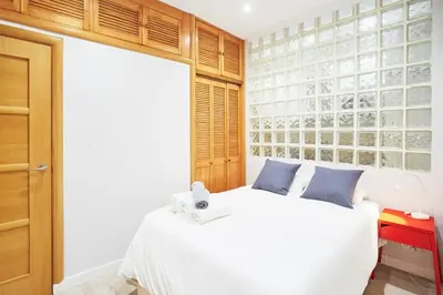 Cama o camas de una habitación en LEEWAYS APARTMENT in ROSARIO