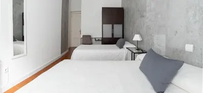 Cama o camas de una habitación en Hostal Tokio