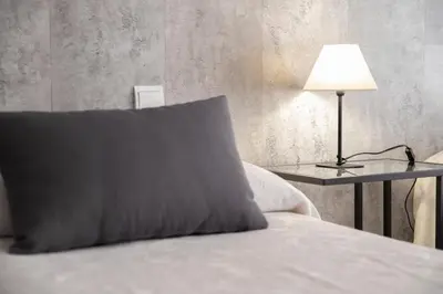Cama o camas de una habitación en Hostal Tokio