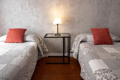 Cama o camas de una habitación en Hostal Tokio