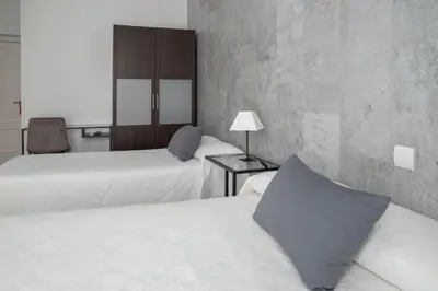 Cama o camas de una habitación en Hostal Tokio