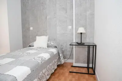 Cama o camas de una habitación en Hostal Tokio