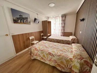 Cama o camas de una habitación en Hostal Rober
