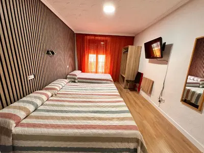 Cama o camas de una habitación en Hostal Rober