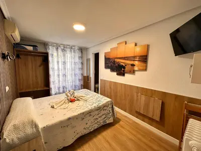 Cama o camas de una habitación en Hostal Rober
