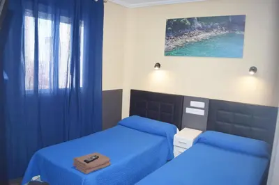 Cama o camas de una habitación en Hostal Numancia