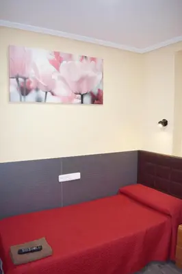 Cama o camas de una habitación en Hostal Numancia