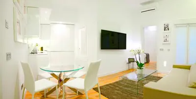 Una televisión o centro de entretenimiento en Prado Suite