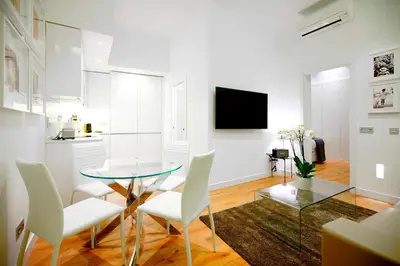 Una televisión o centro de entretenimiento en Prado Suite