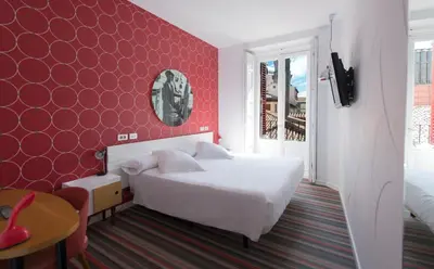Cama o camas de una habitación en Posada del Dragón Boutique Hotel