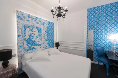 Cama o camas de una habitación en Posada del Dragón Boutique Hotel