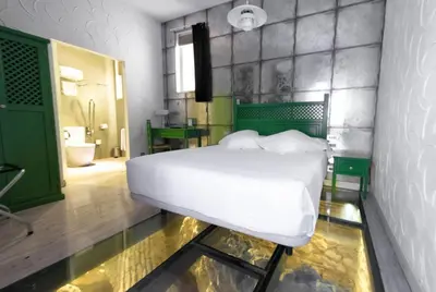 Cama o camas de una habitación en Posada del Dragón Boutique Hotel