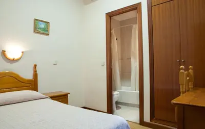 Cama o camas de una habitación en Hostal Zamora