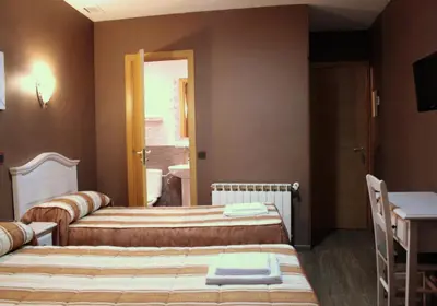 Cama o camas de una habitación en Hostal Regio