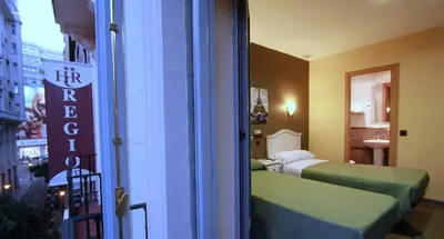 Cama o camas de una habitación en Hostal Regio