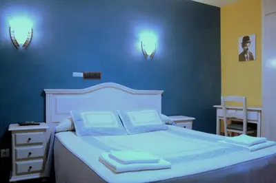 Cama o camas de una habitación en Hostal Regio