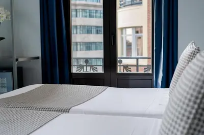 Cama o camas de una habitación en Hostal Carmen-Gran Vía