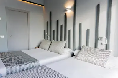 Cama o camas de una habitación en Hostal Carmen-Gran Vía