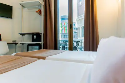 Cama o camas de una habitación en Hostal Gran Via 44