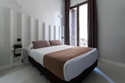 Cama o camas de una habitación en Hostal Gran Via 44