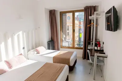 Cama o camas de una habitación en Hostal Gran Via 44