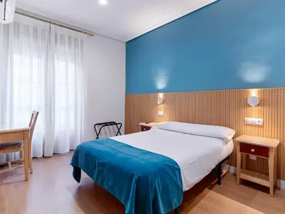 Cama o camas de una habitación en Hostal Bianco
