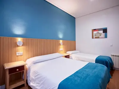 Cama o camas de una habitación en Hostal Bianco