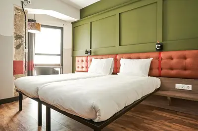 Cama o camas de una habitación en Generator Madrid