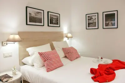 Cama o camas de una habitación en Feelathome Madrid Suites Apartments