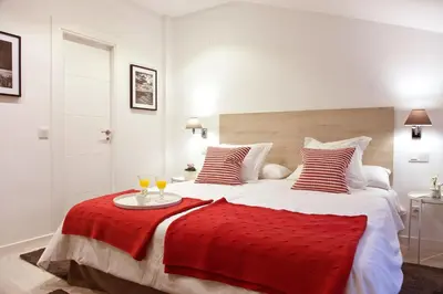 Cama o camas de una habitación en Feelathome Madrid Suites Apartments