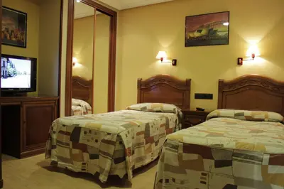 Cama o camas de una habitación en Hostal Ana Belen