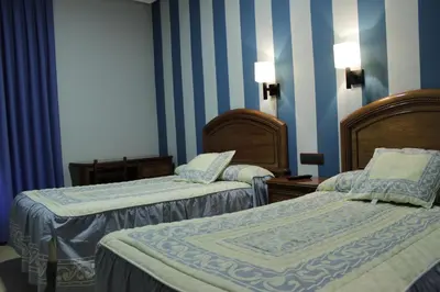 Cama o camas de una habitación en Hostal Ana Belen