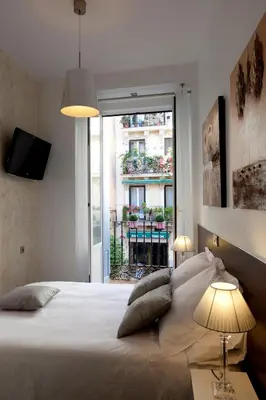 Cama o camas de una habitación en THC Latina Hostel