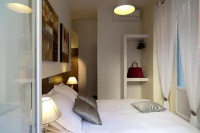 Cama o camas de una habitación en THC Latina Hostel