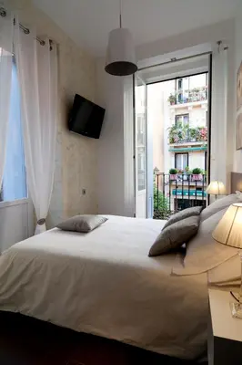 Cama o camas de una habitación en THC Latina Hostel
