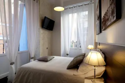 Cama o camas de una habitación en THC Latina Hostel