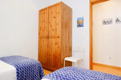 Cama o camas de una habitación en Cosy Apartment Malasaña