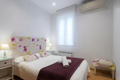 Cama o camas de una habitación en Cosy Apartment Malasaña