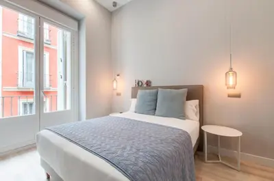 Cama o camas de una habitación en Arenal Suites Gran Vía