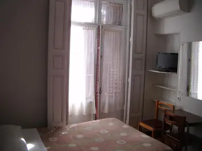 Cama o camas de una habitación en Hostal Tudescos