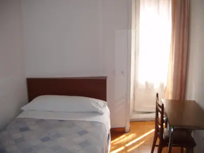 Cama o camas de una habitación en Hostal Tudescos