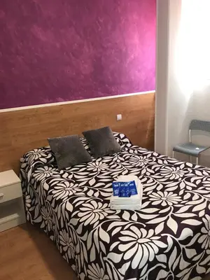 Cama o camas de una habitación en Casa Huésped Magdalena