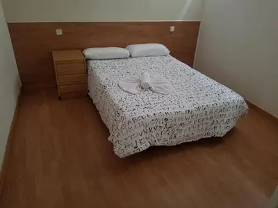 Cama o camas de una habitación en Casa Huésped Magdalena