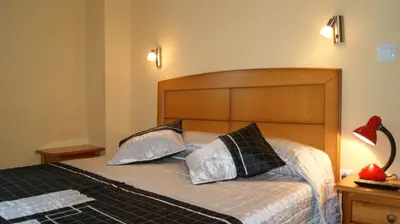 Cama o camas de una habitación en Casa Huésped Magdalena