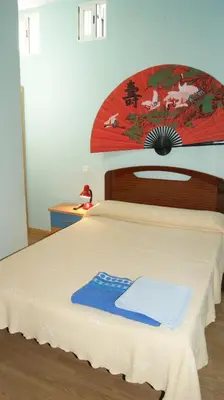 Cama o camas de una habitación en Casa Huésped Magdalena