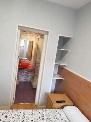Cama o camas de una habitación en Casa Huésped Magdalena