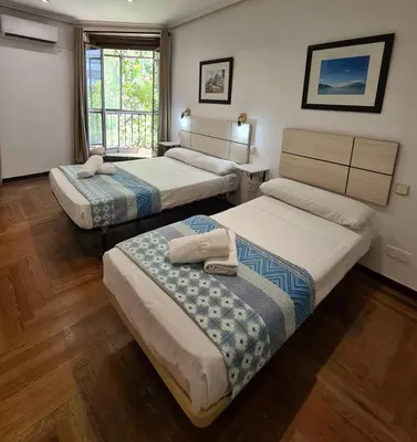 Cama o camas de una habitación en Hostal Santa Barbara
