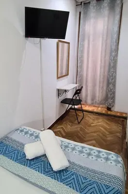 Cama o camas de una habitación en Hostal Santa Barbara